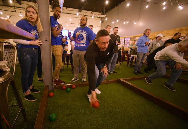 Mark Leary fires a shot. A "Polar Bear Bocce Tournament" was held at 'Olo Pizza Monday. The fundraiser helped raise money to benefit the North High School Football team.