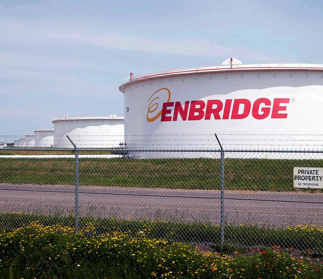 This June 29, 2018 file photo shows tanks at the Enbridge Energy terminal in Superior, Wis.