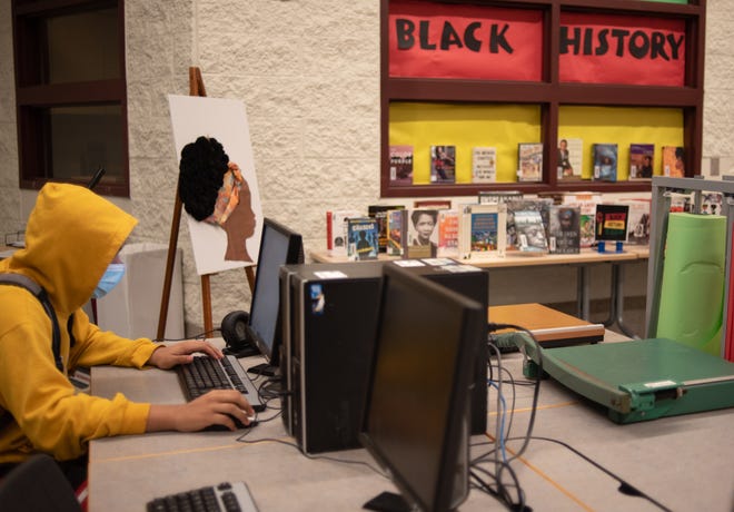 Eastern sophomore Xayvion Mildton is working on a project on Tuesday, March 22, 2022 at the library. "I need a little more time for books, so it's a nice respite," he said.