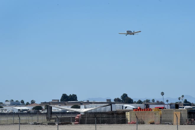 A plane takes off from the county-owned Oxnard Airport. The Oxnard City Council approved a zone change in its first reading Tuesday for the development of 90 condominiums across the street from the airport.