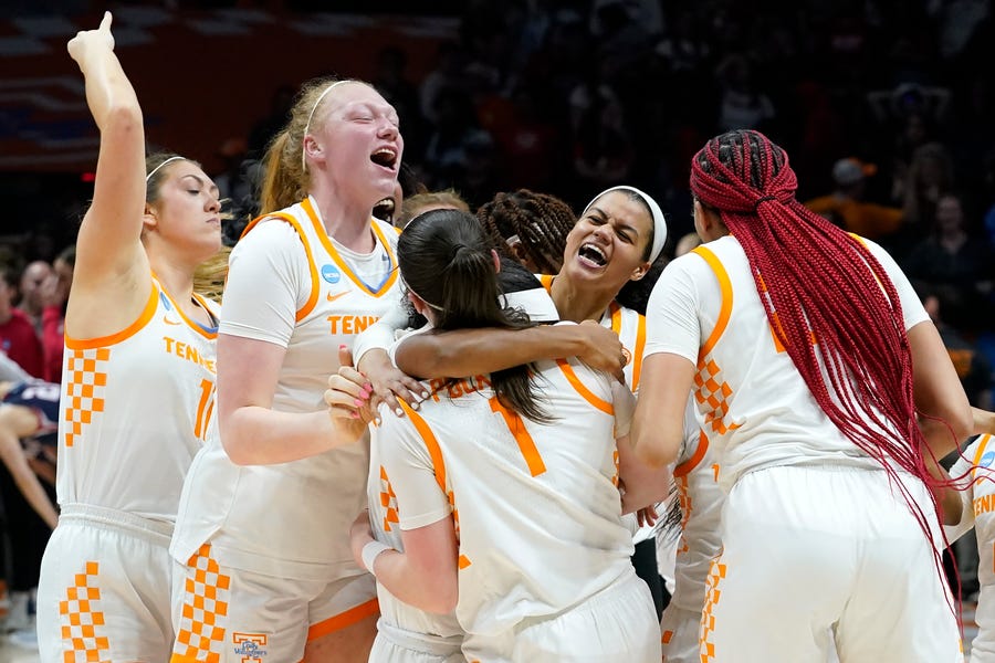 Tennessee players celebrate after holding off Belmont in the final seconds in Knoxville.