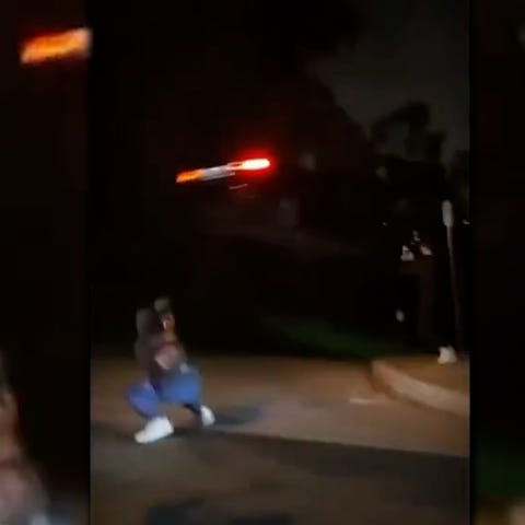 A screenshot from the viral video of a Tesla stunt