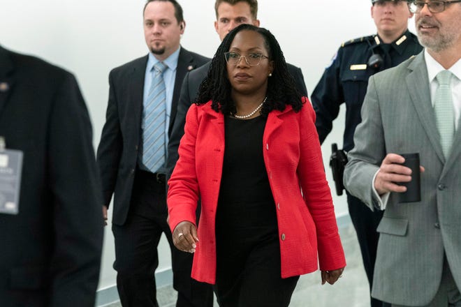 Supreme Court nominee Ketanji Brown Jackson walks to the hearing room after a break, on the second day of her confirmation hearing before the Senate Judiciary Committee on March 22, 2022, in Washington.