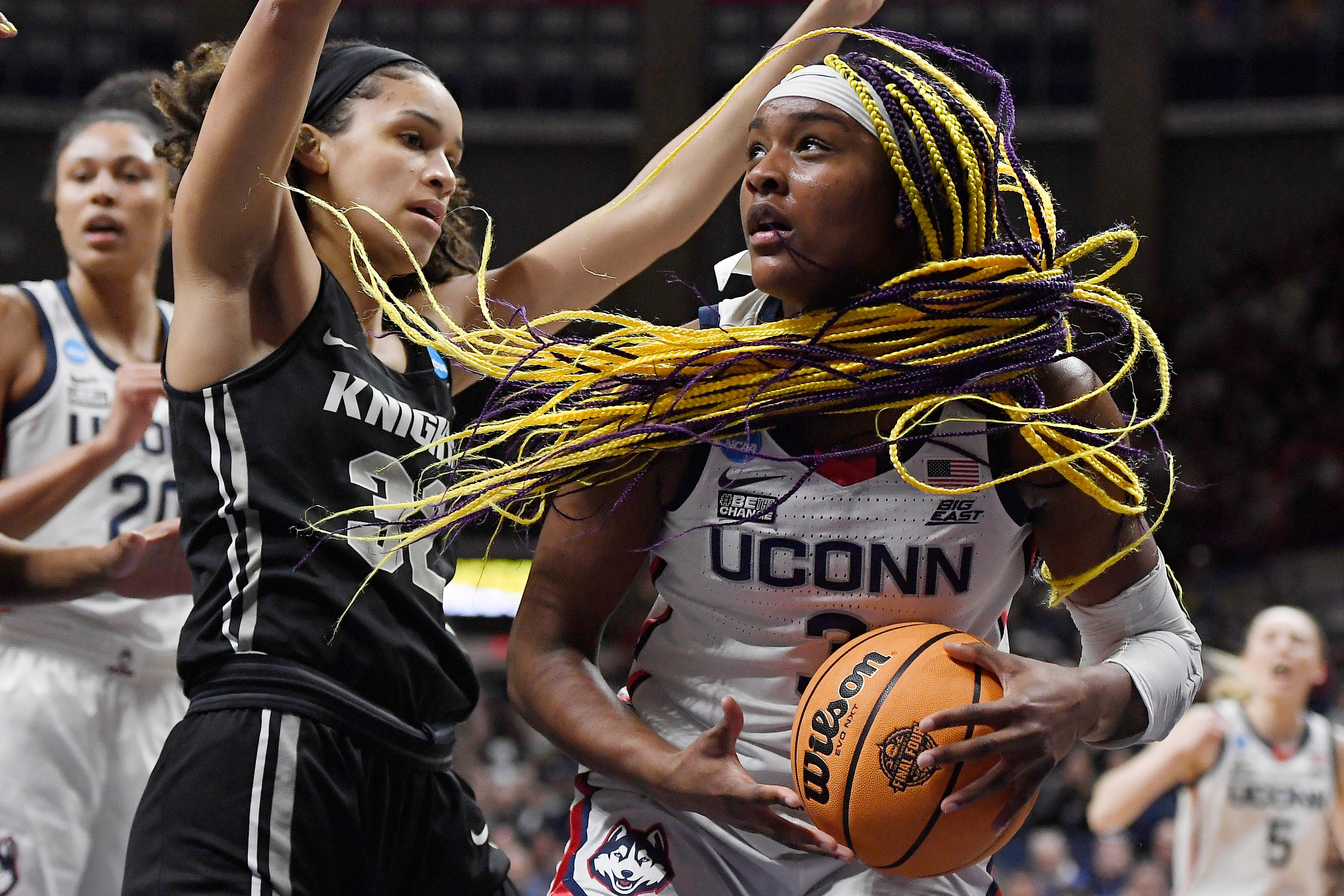 The UConn women’s basketball team took smaller, less-expensive planes than the men’s team in the 2018-19 and 2019-20 seasons. Connecticut's Aaliyah Edwards is guarded by Central Florida's Brittney Smith.