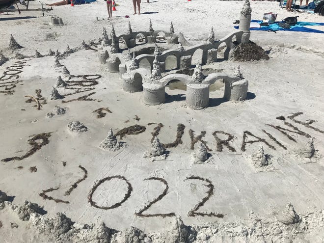 A sand sculpture on Siesta Key Beach in Florida sends a message in support of Ukraine.