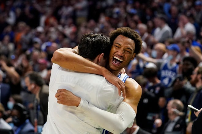 Duke's Wendell Moore Jr. (0) hugs a teammate after a win against Michigan State in a college basketball game in the second round of the NCAA tournament, Sunday, March 20, 2022, in Greenville, S.C. (AP Photo/Brynn Anderson)