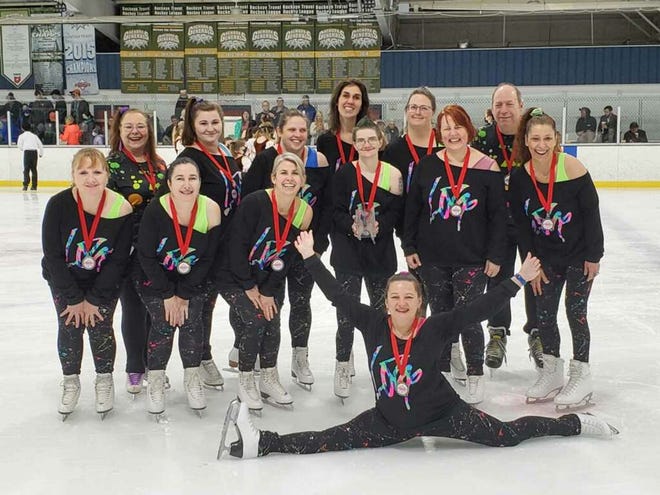 Abbey Roy, back row center, is part of the Lou & Gib Reese Ice Arena adult figure skating group.