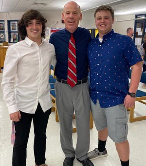 Scott Beery (center), Licking Valley Middle School principal for the past 14 years, is shown with school board student representatives Rylan Felumlee (left) and Evan Fee (right) after he was approved as new Valley superintendent at this week's board meeting.