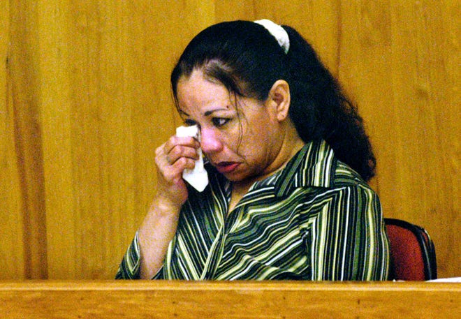 Melissa Elizabeth Lucio wipes her eyes in a courtroom in Brownsville, Texas, on July 10, 2008. Lucio was convicted of capital murder in the death of her 2-year-old daughter Mariah, and she was sentenced to death. Lucio maintains that the child's death was accidental.
