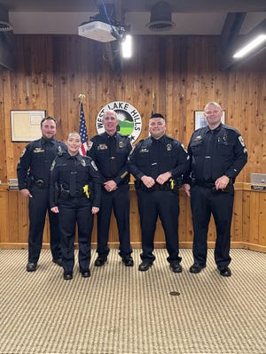 West Lake Hills police officer Erika DeVaun, second from left, was sworn in Wednesday as the department's newest officer. In addition, Jared Mathis, far left, Aaron Ozuna, second from right, and Robert Allensworth, far right, were promoted to corporal. At center is police chief Scott Gerdes.
