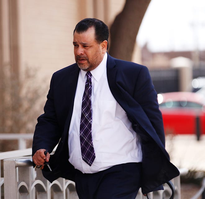 Timothy Vasquez, the former police chief of San Angelo, heads into the federal courthouse in Lubbock where he is on trial on bribery and mail fraud charges.