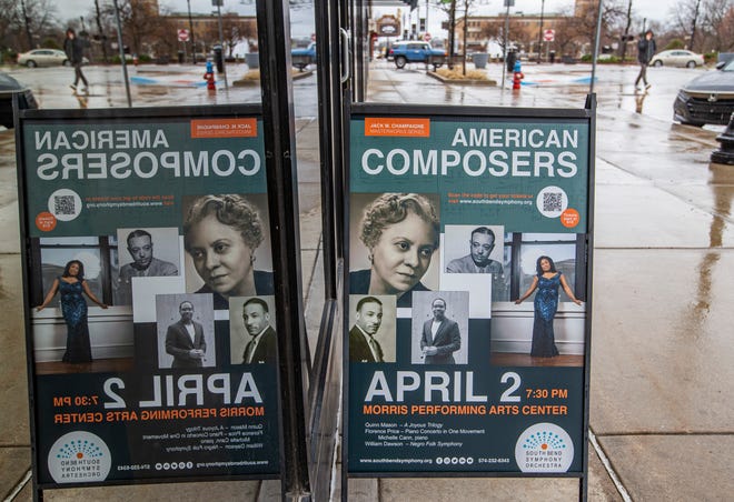 A sign advertising the "American Composers" concert reflects against the windows outside the South Bend Symphony Orchestra's office on Thursday, March 24, 2022, in South Bend.