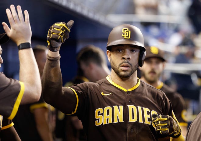 Jul 25, 2021; Miami, Florida, USA; San Diego Padres San Diego Padres Tommy Pham (28) is congratulated after scoring a run during the second inning against the Miami Marlins at loanDepot Park. Mandatory Credit: Rhona Wise-USA TODAY Sports