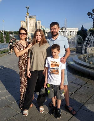 Liza, whose full name is Yelyzaveta Yaryshkina, and her family take a picture in Kyiv, Ukraine, in 2020.