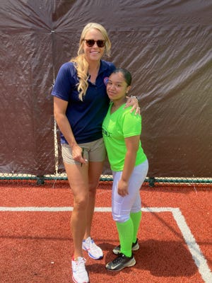 Former Olympic softball star Jennie Finch with former Eastside Ghost infielder Stephanie Viera.