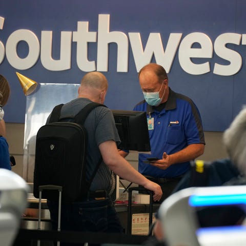Southwest Airlines ticketing agent helps a travele