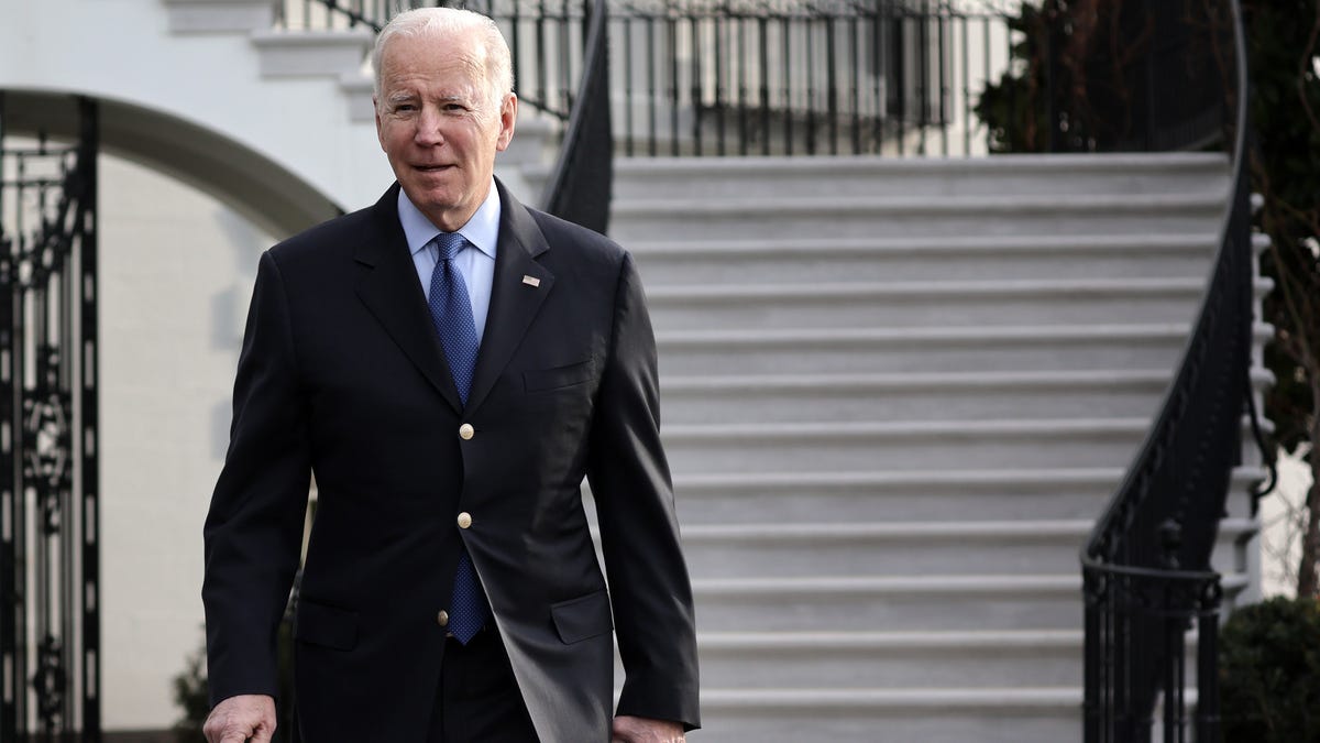 President Joe Biden walks towards members of the press prior to a Marine One departure from the White House on Wednesday, March 23, 2022 in Washington.