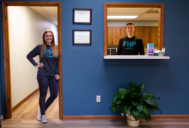 Doctors Cory and Cassie Keesee, owners and chiropractors at Fortitude Health and Performance, stand in the lobby area in their office in Johnstown, Ohio on March 24, 2022.