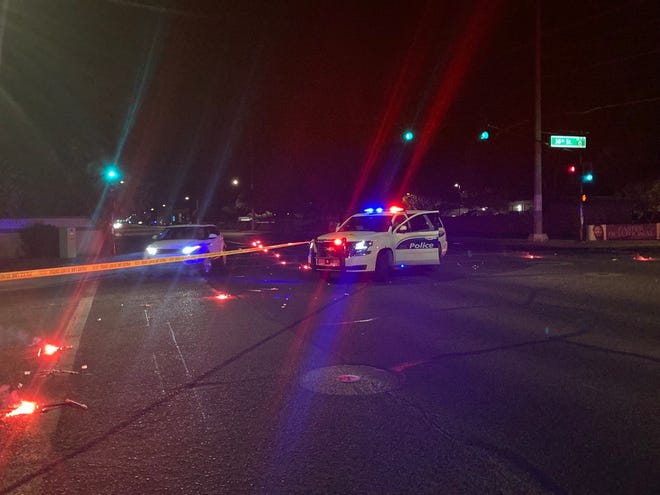 Several Phoenix police patrol vehicles surround the scene of a shooting investigation near 36th Street and Shea Boulevard on March 24, 2022.