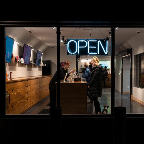 Open sign at Lux Pot Shop in Fremont, Washington.