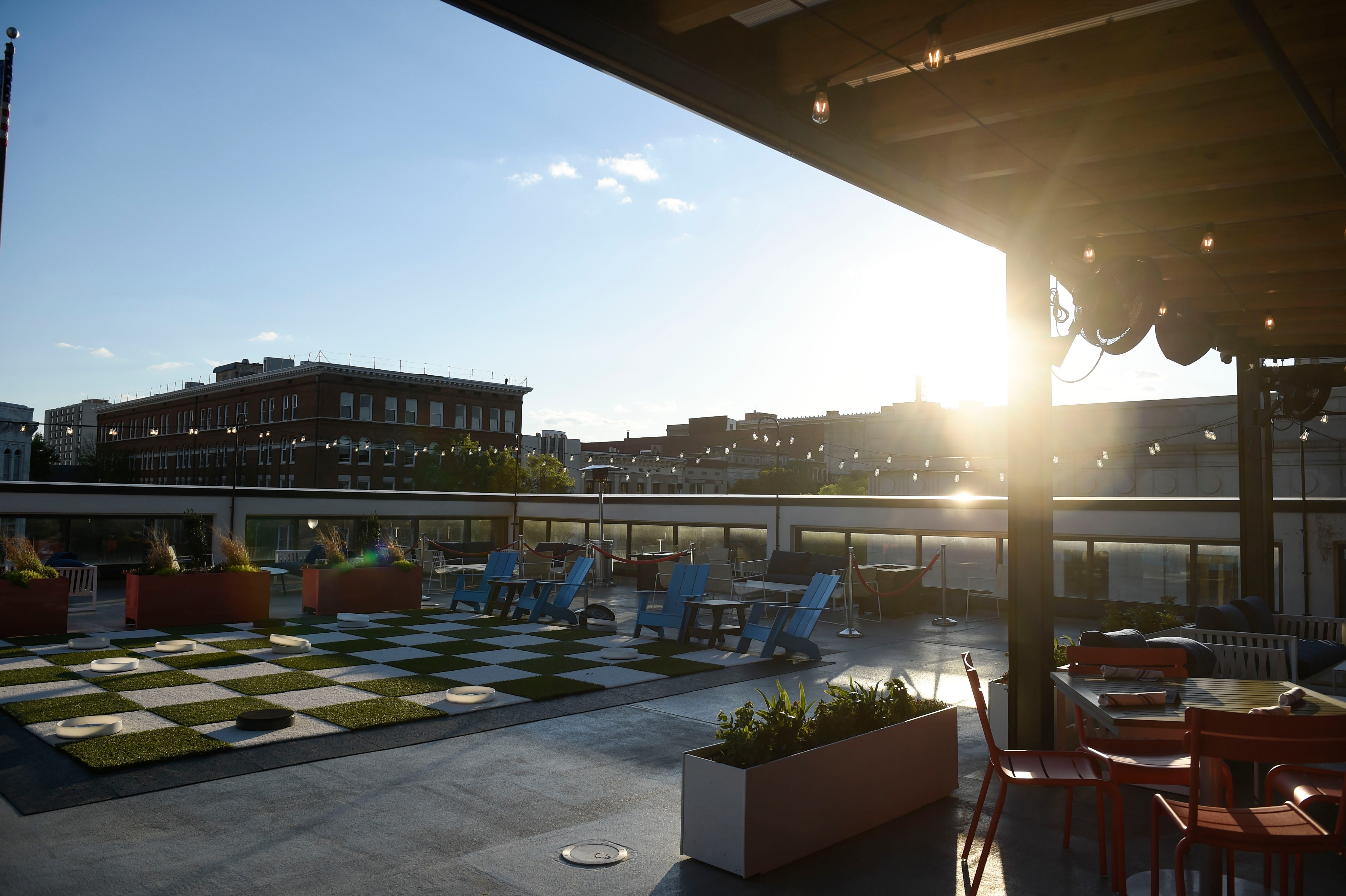 The patio of Edgar's Above Broad has a giant checkerboard, a putting green and a view of the Augusta skyline.