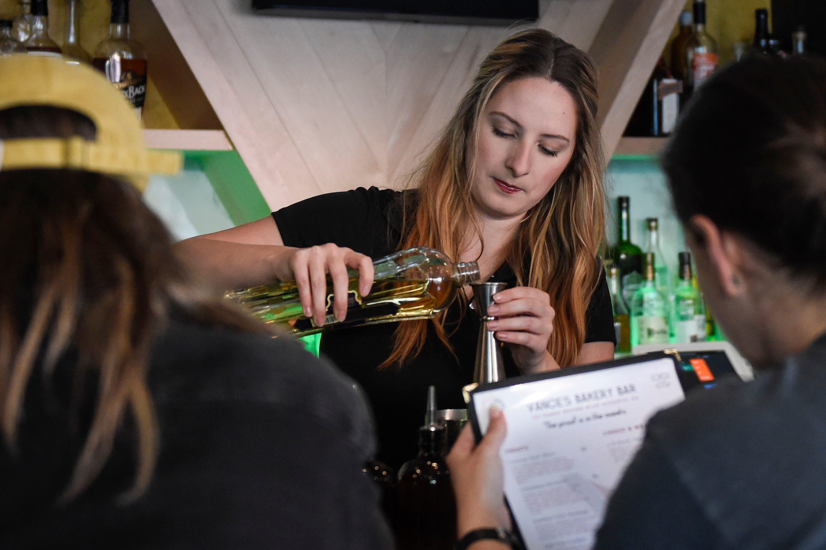 Bartender Hannah Hayes makes a drink at Vance's Bakery bar in downtown Augusta.