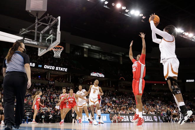 Texas forward DeYona Gaston, right, shoots over Ohio State forward Tanaya Beacham (35) during the first half of a college basketball game in the Sweet 16 round of the NCAA tournament, Friday, March 25, 2022, in Spokane, Wash. (AP Photo/Young Kwak)