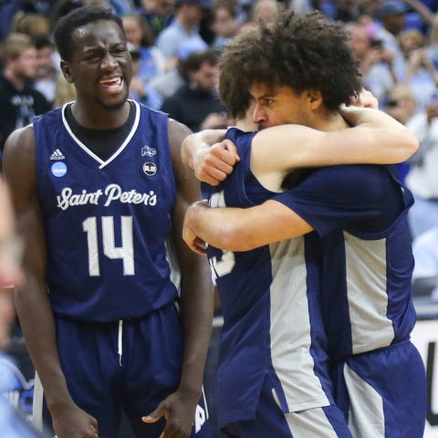 Saint Peter's Hassan Drame (14) celebrates as Doug