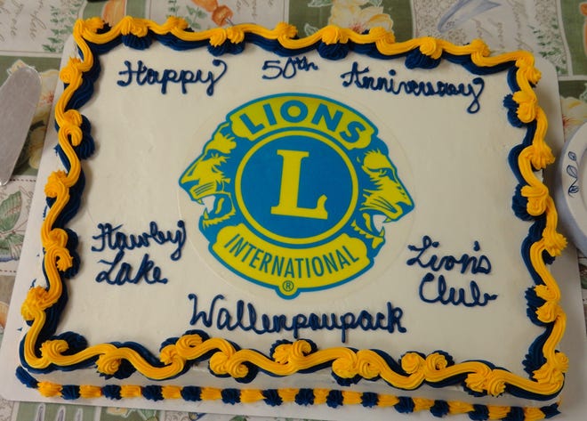 FEEDING THE LIONS- The 50th anniversary cake for the Hawley Lake Wallenpaupack Lions Club was ready for the members to share at their March 17 meeting at the Hawley 1st Presbyterian church hall.