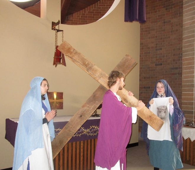 Caroline Girten, left, as Mary; Nathan Venneberg as Jesus, and Taylor Hawkins portraying Veronica, rehearse their parts for the Living Stations of the Cross to be presented from 8 to 9 p.m. on Sunday, April 10, at St. Malachy’s Church, 595 East Ogden Ave., Geneseo.