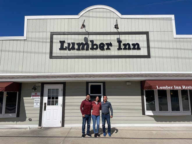Lumber Inn owner Raul Perez (right) celebrates two decades at the Delafield staple with his daughter and son.