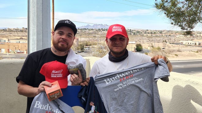 Zac España (left) and Roman Lopez are pictured with their winnings at the cornhole tournament March 26, 2022 put on by Nation's Finest and Hooters in support of veterans in need. ”We’re just happy you guys brought people together to have some fun today, and we are happy to do what we can for our veterans,” España said.