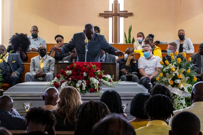 Family and friends celebrate the life of Ivory Murrell Sr., who died at the age of 95, during his funeral service at Ajalon Missionary Baptist Church in Palm Springs, Calif., on Monday, March 28, 2022.