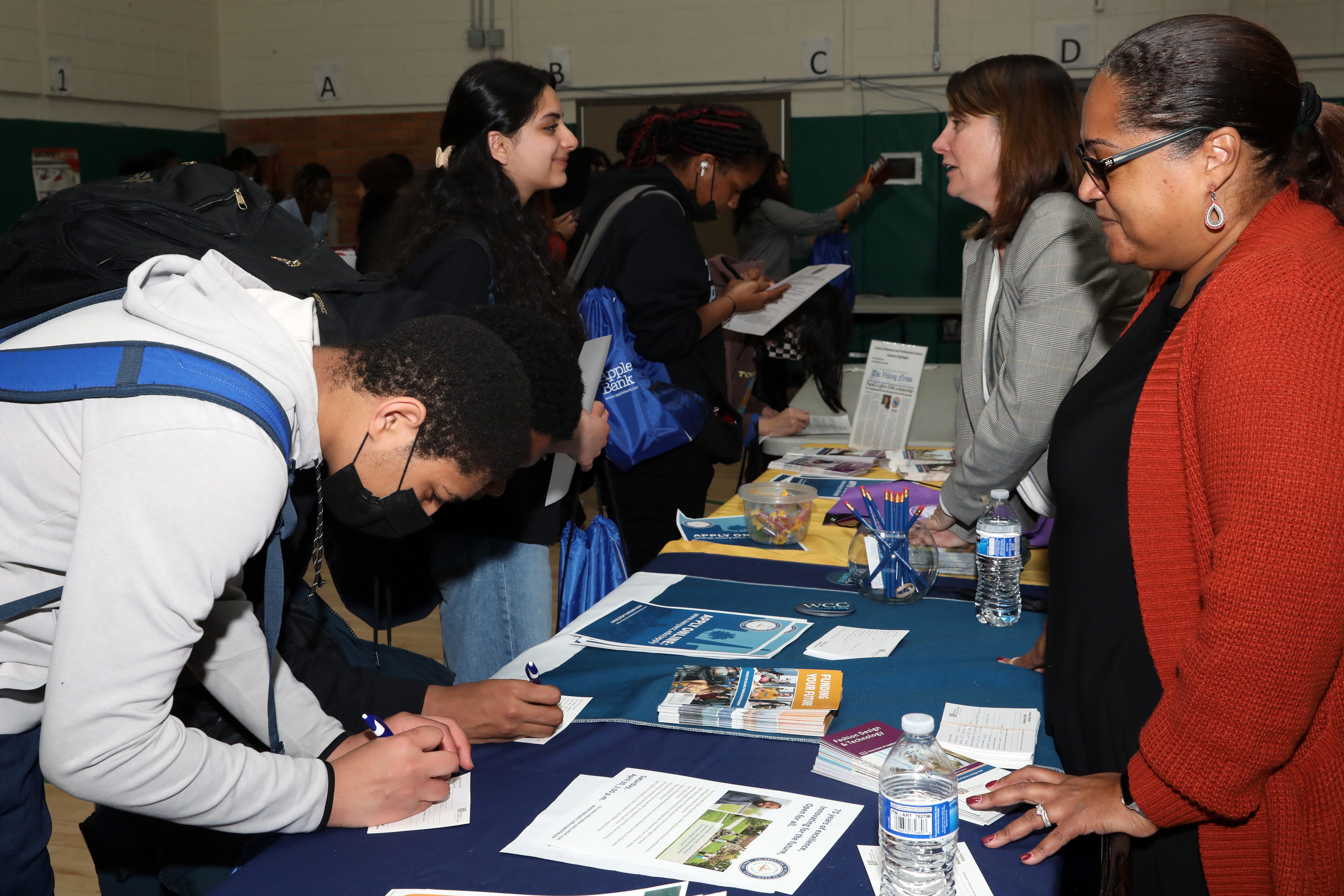 Students visit the Westchester Community College booth at the College and Career Fair at Gorton High School on March 23, 2022, in Yonkers.