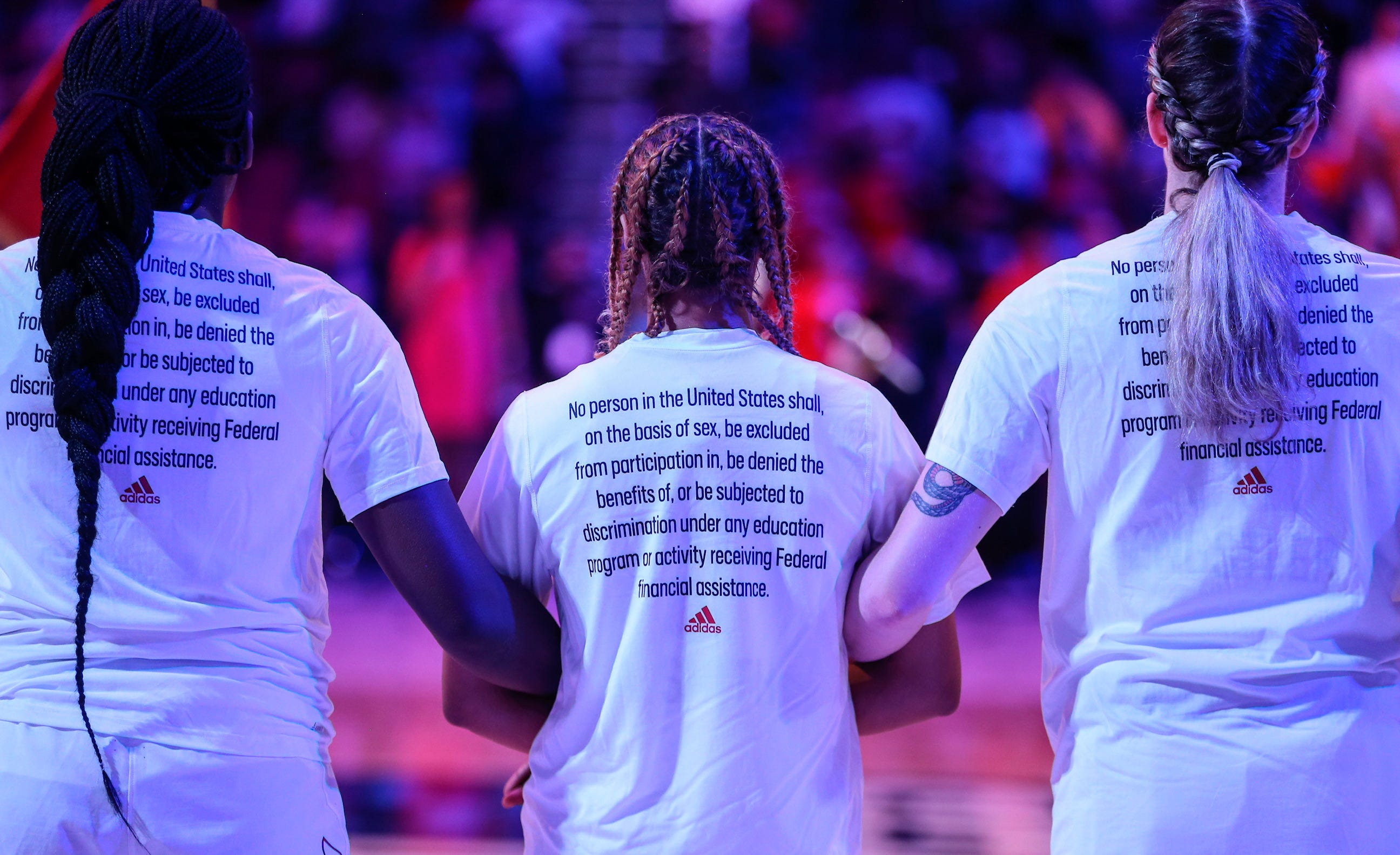 Louisville Cardinals prepare for the Sweet 16 round of the NCAA tournament wearing adidas 'More Is Possible' tees as part of adidas' NIL announcement that also celebrates the 50th anniversary of Title IX in Wichita, Kan., on Saturday, March 26, 2022. 