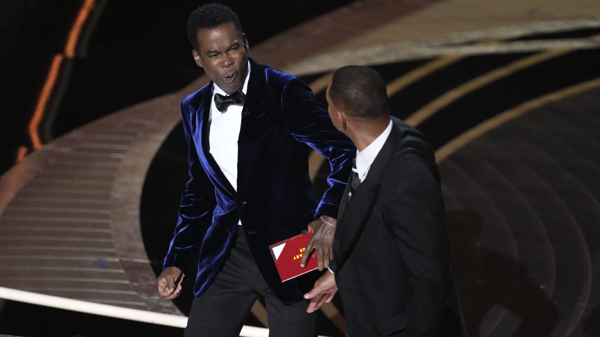 Will Smith confronts Chris Rock as he presents the award for best documentary feature.