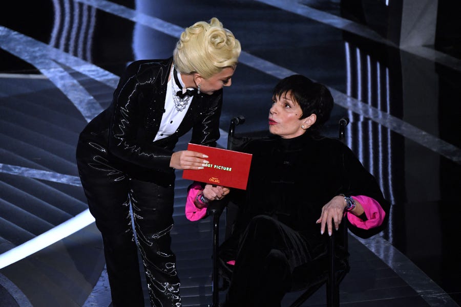 US actress-singer Lady Gaga (L) and US actress Liza Minnelli announce the Best Picture award onstage during the 94th Oscars at the Dolby Theatre in Hollywood, California on March 27, 2022. (Photo by Robyn Beck / AFP) (Photo by ROBYN BECK/AFP via Getty Images) ORG XMIT: 0 ORIG FILE ID: AFP_327462U.jpg