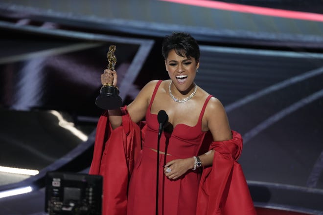 Ariana DeBose accepts the award for best actress in a supporting role for her performance in "West Side Story".