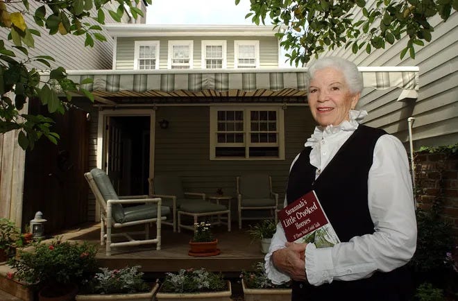 Susan B. Johnson, author of "The crooked little houses of Savannah," lives in one of them at 503 East Saint Julian Street and hangs out in his back garden.