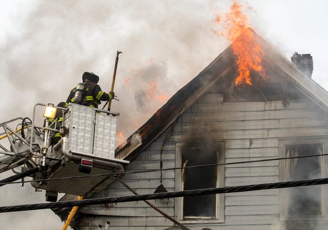 Firefighters from many surrounding towns battled a 4-alarm blaze in a multi-family home at 20 Graham Street Tuesday.