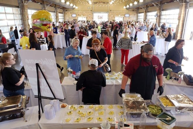 The COVID-19 pandemic canceled the planned 2020 and 2021 West Alabama Food and Wine Festivals, but it's returning for 2022 April 7. In this file photo from 2019, patrons at the River Market sample wares from the food and drink vendors.