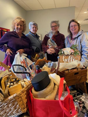 Another morning of unloading donations for this year's Rotary AuctionFest. Pictured (left to right) are Marylyn Strang, Virginia Hammontree, Kathy Wells and Linda Cooperider. They have posted every item on a pre-bidding website. You can take part without having tickets for the live event.