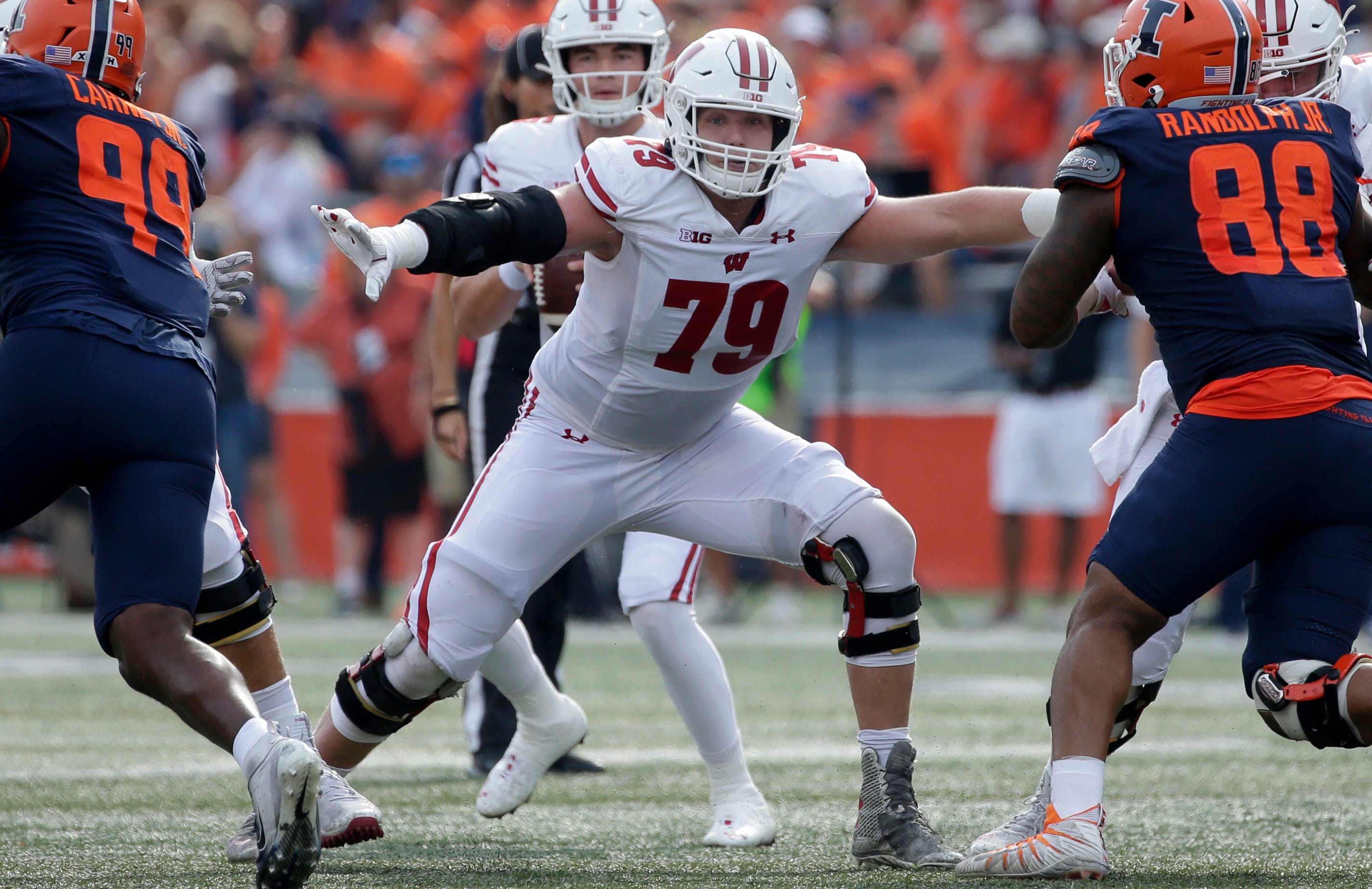 Jack Nelson blocks for Badgers quarterback Graham Mertz