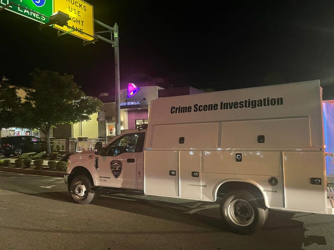 A Redding Police Department Crime Scene Investigation truck is parked in front of the Taco Bell in downtown Redding after a fatal stabbing Monday night, March 28, 2022.