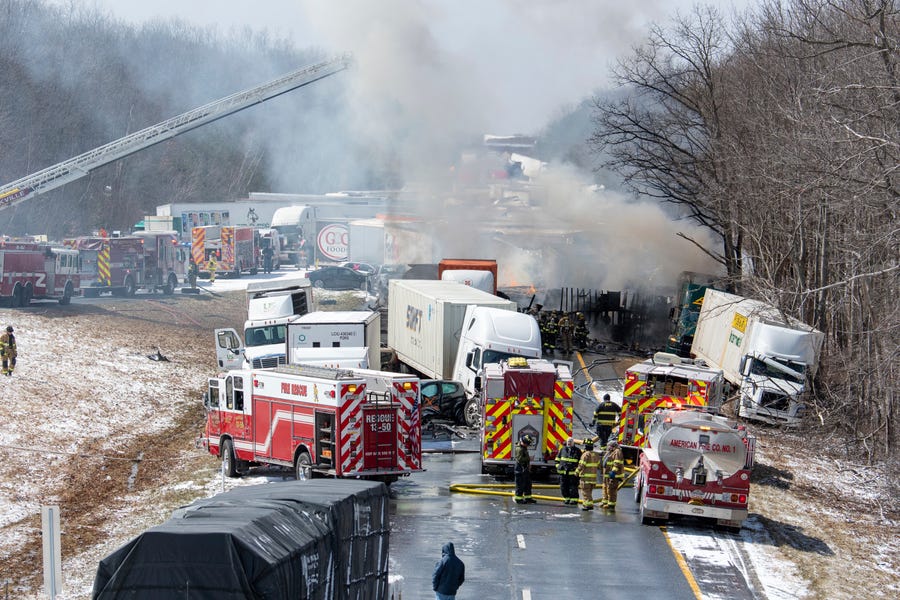 Emergency vehicles work at the scene of a multi-vehicle accident on Interstate 81 in Foster Township, Pa.