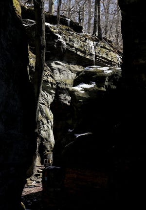 Sunlight shines through a passage at Whipp's Ledges on Tuesday in Hinckley.