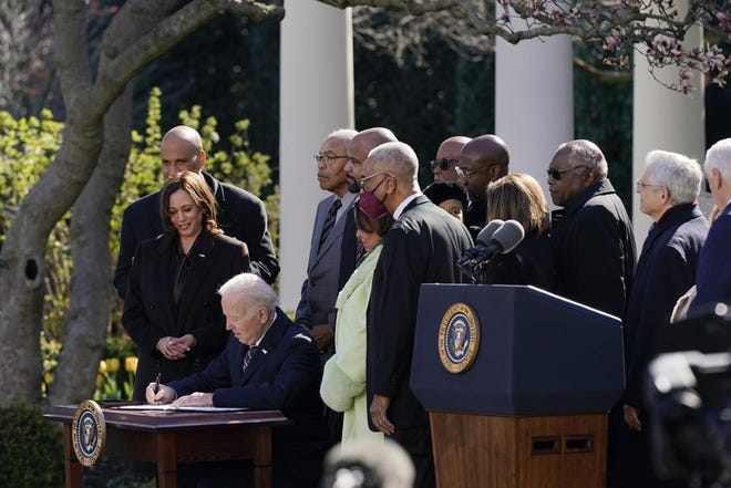 President Joe Biden signs the Emmett Till Anti-Lynching Act in the Rose Garden of the White House Tuesday in Washington.