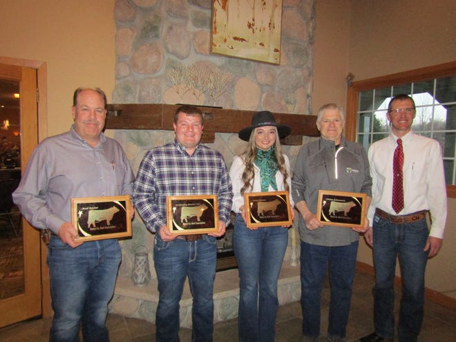 Henry County Beef Association president Chad Horsley, of Galva, right, presented awards at the organization's annual banquet to, from the left, Mike Rogers, of Coal Valley; Matt Johnson, of Kewanee; Katie Miller, of New Windsor; and Dan Strange, of Bishop Hill.