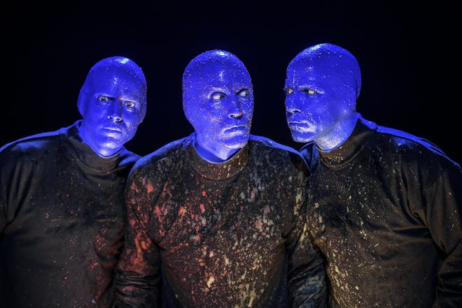 The three-person cast of Blue Man Group