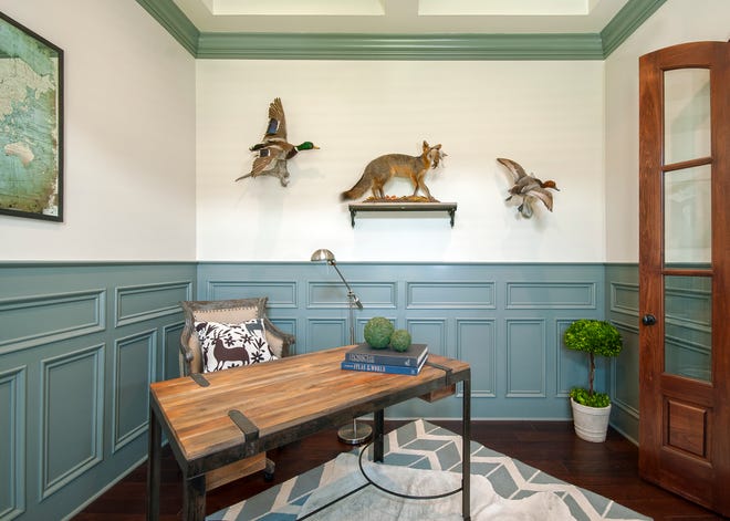 This home office that features an Italian writing desk, taxidermy animals, hide over rug and antiqued mirror map art is inside a 6-bed, 3-and-a-half bath, traditional-style, two-story home in the Beech Spring Farm subdivision of East Louisville.